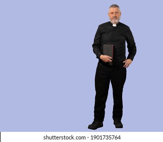 A priest in a black shirt with a white clerical collar. The older man has gray hair, a beard and a Bible in his hand. The person is isolated against a blue background.