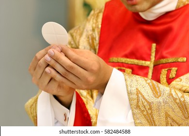 Priest celebrate mass at the church - Shutterstock ID 582484588