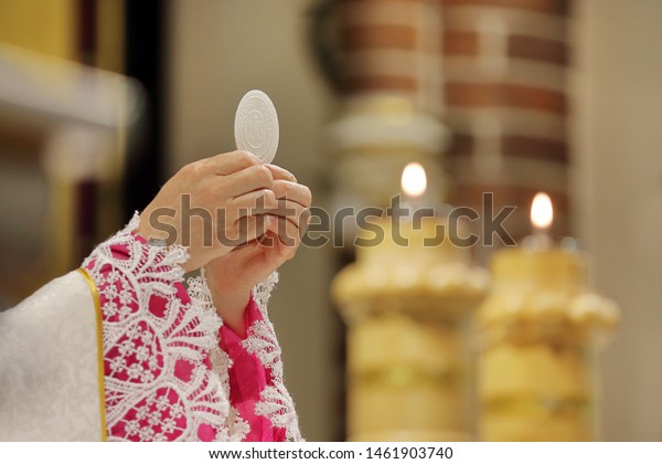 Priest celebrate mass at the church and empty place\
for text \
\
