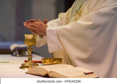 Priest during a wedding ceremony/nuptial mass (shallow DOF; color toned image) - Shutterstock ID 474142246