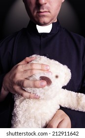 The Priest With Plush Mascot