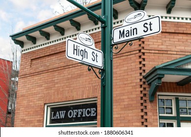 Priest River, Idaho USA - December 20 2020: A Main Street And High Street Sign On A Corner In The Historic Downtown City Of Priest River, Idaho.