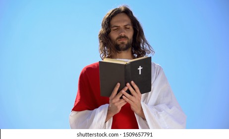 Priest In Robe Reading Holy Bible, Closing Eyes To Pray, Christian Theology