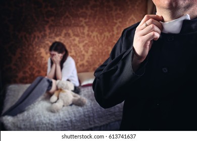 Priest in the room with a young girl