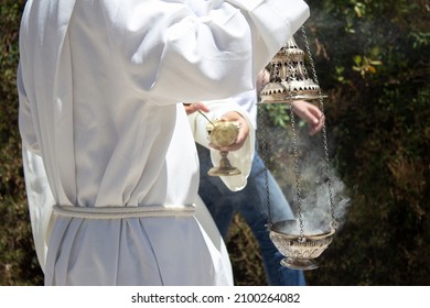 Priest Spreads Incense Along The Way