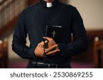 Priest standing in a church, holding a bible and rosary beads, praying devoutly. The atmosphere is filled with faith and spirituality, exuding hope and belief