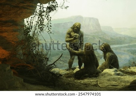 Primal tribe of ancient wild people animal skin and stone axes eating frying meat on bonfire staying in cave. Neanderthals. Ice age.