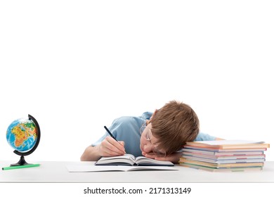 Primare schoolboy with glasses is tired while doing homework. Boy sleeps at his desk Portrait of tired boy on white background - Powered by Shutterstock