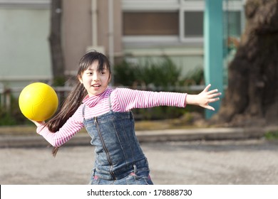 Primary Japanese Girl Playing Dodge Ball