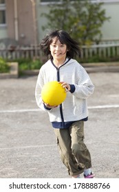 Primary Japanese Girl Playing Dodge Ball