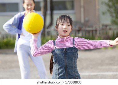 Primary Japanese Girl Playing Dodge Ball