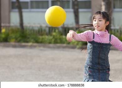 Primary Japanese Girl Playing Dodge Ball