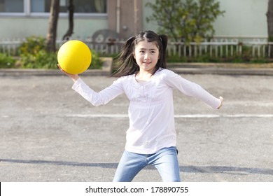 Primary Japanese Girl Playing Dodge Ball