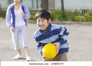 Primary Japanese Girl Playing Dodge Ball