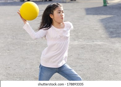 Primary Japanese Girl Playing Dodge Ball