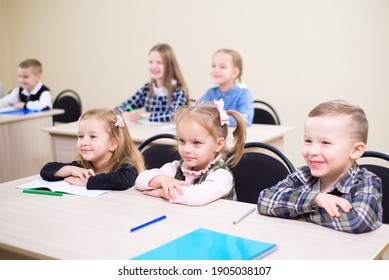 Primary School Children Work Together In Class.