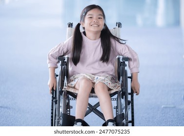 Primary school girl in wheelchair in school. Image of a schoolchild using a wheelchair due to injury or other reasons. - Powered by Shutterstock