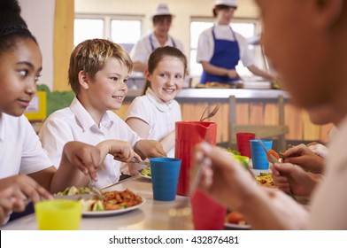 Primary School Kids At A Table In School Cafeteria, Close Up