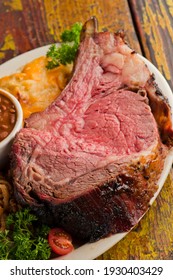 Prime Rib. Beef Prime Rib bbq. Beef rubbed in spices and seasoning and slow cooked in a smoke house with mesquite wood chips. Traditional barbecue Texas Smoke House beef prime rib.  - Shutterstock ID 1930403429