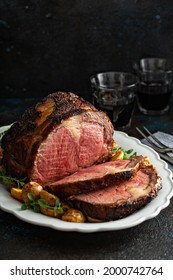Prime rib boneless beef roast sliced for a holiday or celebration dinner - Shutterstock ID 2000742764