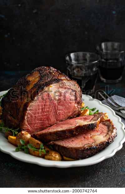 Prime rib boneless beef roast sliced for a holiday\
or celebration dinner