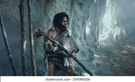 Primeval Caveman Wearing Animal Skin Holds Stock Photo 1595983336 ...