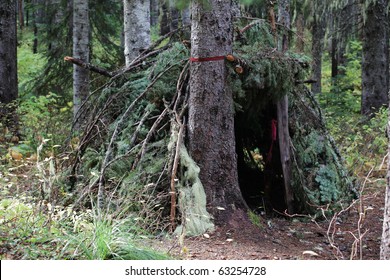 Primitive Survival Shelter In A Forest