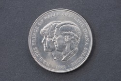 Prince Charles And Lady Diana Spencer Silver Crown Coin, Isolated On Black Background.