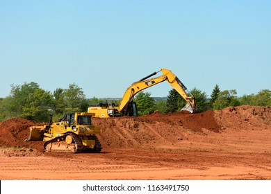 Prince Edward Island, Canada -Aug 13th 2018: The CAT 349E Hydraulic Excavator with the CAT D6T dozer at the construction site.
