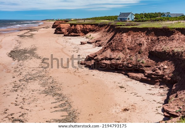 Prince Edward Island, Canada - June 12, 2017: The\
famous red cliffs and beaches of Canada\'s maritime province, Prince\
Edward Island.