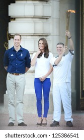 Prince William And Catherine, Duchess Of Cambridge Welcome The Olympic Torch To Buckingham Palace, London, UK. July 26, 2012.