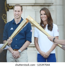 Prince William And Catherine, Duchess Of Cambridge Welcome The Olympic Torch To Buckingham Palace, London, UK. July 26, 2012.