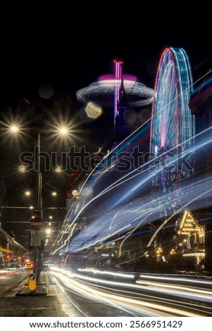 Princess Street in Edinburgh at night, the bus driving down the street in long exposure, Christmas lights and market 