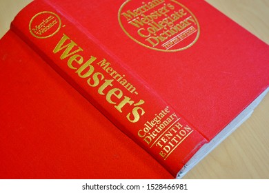 PRINCETON, NJ -11 OCT 2019- View of a Merriam Websters English dictionary with a red cover on a desk.