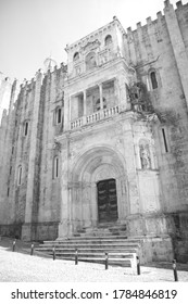 Principal Facade Of Se Velha, Santa Maria De Coimbra, The Old Cathedral Of Coimbra, In Black And White, Portugal.