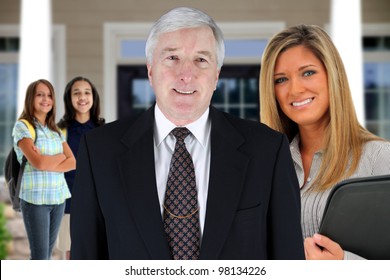 Principal With Teacher And Students At School