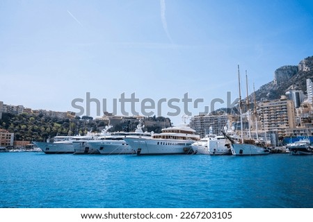 Principality of Monaco. Beautiful panoramic views over Monaco, landscape of golden hours. Views of the apartment building, casino, large port with luxury yachts. Monaco is a popular tourist destinatio