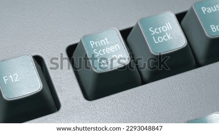 Print screen key on an old retro desktop PC computer keyboard, closeup. Printscreen, screenshot, screencap or screengrab simple abstract concept, symbol, nobody. Saving screen image conceptual shot