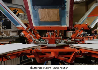 print screening apparatus. serigraph printing production. silk screen textile printery - Shutterstock ID 2105785664