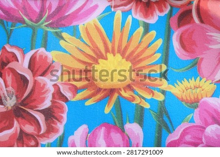 printed blue eva mat features a vibrant pink and yelow floral pattern                                         