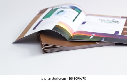 printed brochures with saddle stitching from the printing house - Shutterstock ID 1899090670