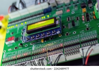 Printed circuit board - pcb for elevator with digital display module at lift exhibition, trade show - close up view. Technology and electronic concept