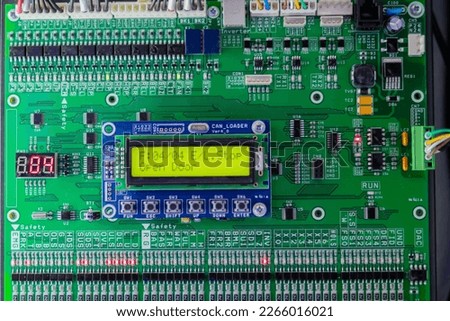 Printed circuit board - pcb for elevator with digital display module at lift exhibition, trade show - close up front view. Technology and electronic concept