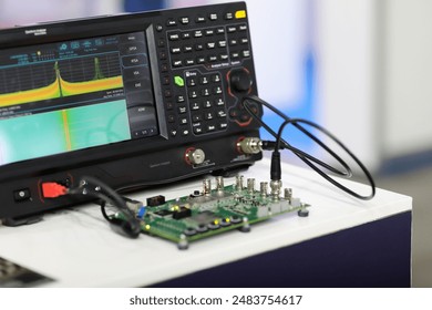 Printed circuit board testing by the spectrum analyzer in the telecommunication laboratory. Selective focus. - Powered by Shutterstock