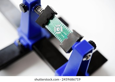 A printed circuit board for trace elements. Radio electronics. A holder for printed circuit boards.