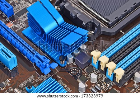 Printed computer motherboard with RAM connector slot