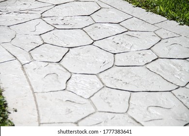 Printed grey concrete path compass - Shutterstock ID 1777383641
