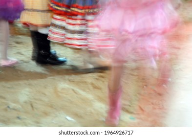 Printed And Very Colorful Round Skirts During Dance At Festa Junina Or June Party Translated Into English. Blur Background.