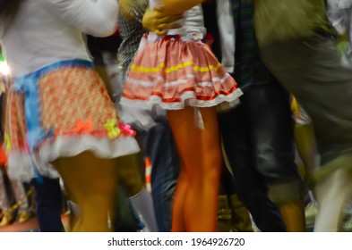 Printed And Very Colorful Round Skirts During Dance At Festa Junina Or June Party Translated Into English. Blur Background.