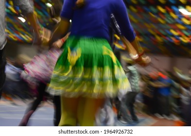 Printed And Very Colorful Round Skirts During Dance At Festa Junina Or June Party Translated Into English. Blur Background.